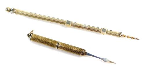 A silver propelling cocktail and swivel stick, together with a silver propelling tooth pick. (2)