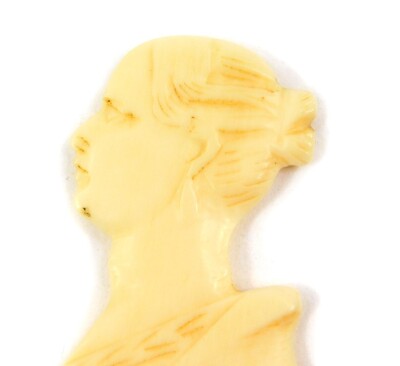 A Victorian ivory paper knife, carved with the bust profile of a lady, possibly HM Queen Victoria, 25cm wide., together with a 19thC ebony and ivory page marker, carved with a furled anchor, an ivory spinning top carved with four letters, and a bone carvi - 2