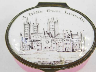 A Bilston enamel late 18thC patch box, pink ground, the hinged lid decorated with 'A Trifle From Lincoln'., illustrating Lincoln Cathedral, 5cm wide. - 2