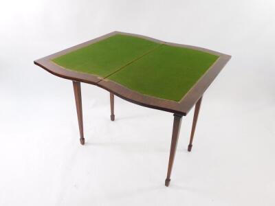 An Edwardian Sheraton Revival card table, with shaped rectangular fold over top with cross banding, on square taper legs with spade feet, 85cm wide. - 3