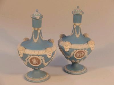 A pair of Wedgwood blue jasper classical urn shaped bottle vases with covers