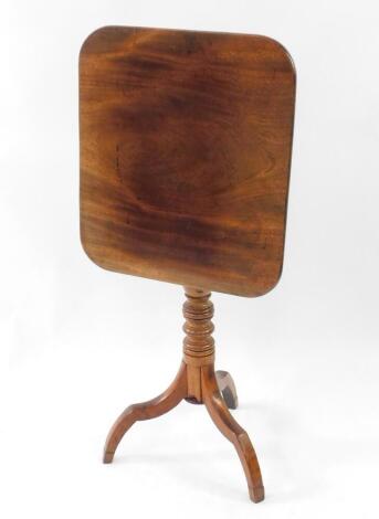 A Victorian mahogany tripod table, with rounded rectangular folding top and turned pillar.