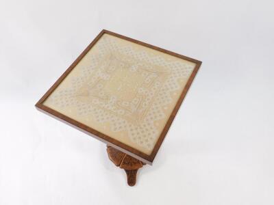 A Victorian occasional table, with lace work and glazed tilt top, on a column and shaped base with rosewood marquetry on walnut, and stained pine, 62cm high, 44cm square. - 2