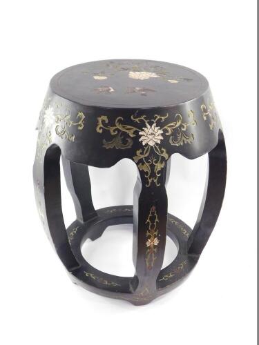 A mid 20thC Chinese hardwood lacquer stool, of circular form, with painted polychrome decoration of birds and peonies, 48cm high, 40cm diameter.