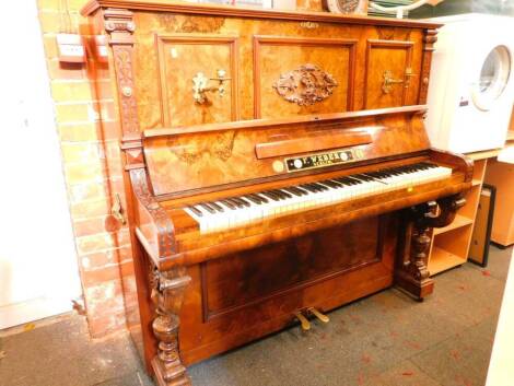 A 19thC German figured and burr walnut cased upright piano by F Weber of Berlin, the case having blind fret and applied moulded decoration, cast brass side handles, the interior revealing a brass over wood overstrung mechanism, and label VNWIEN 1875 C Gol