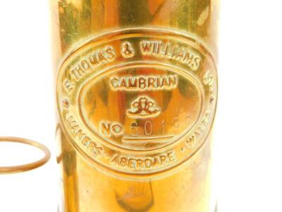 An E Thomas & Williams Ltd Cambrian miner's lamp, No 60199, 25cm high, together with a smaller lamp, 16cm high. (2) - 2