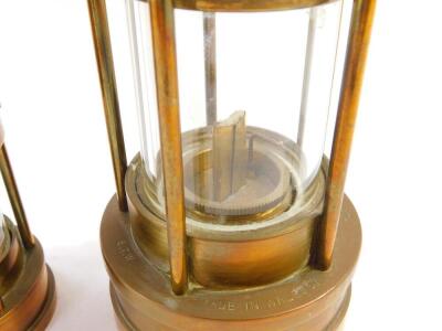 An E Thomas & Williams Ltd Cambrian miner's lamp, No 60199, 25cm high, together with a smaller lamp, 16cm high. (2) - 3