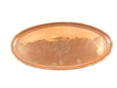 An Arts & Crafts Period Hugh Wallis oval copper tray, engraved centrally with flowers, stamped HW, 37cm wide.