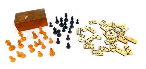 A Staunton type chess set, boxed, one black pawn lacking, together with a set of bone and ebony dominoes, boxed. (2)