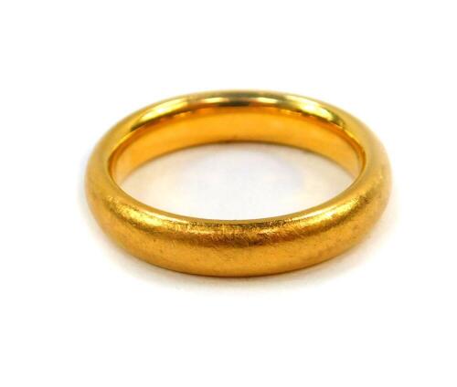 A 22ct gold wedding band, size K, 6.8g.