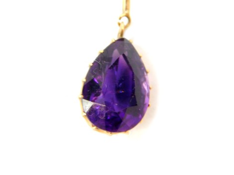 A pear shaped amethyst pendant, set in yellow metal, on an oval link neck chain, with bolt ring clasp, marked 9ct, 8.5g.