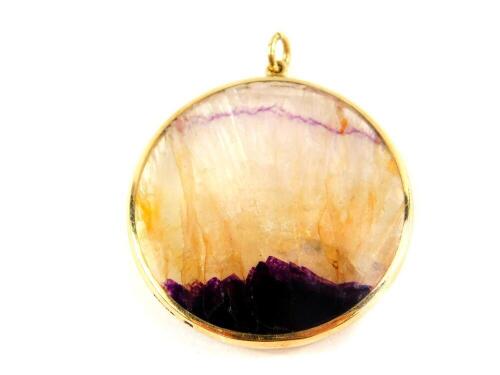 A 9ct gold and Blue John set circular pendant, 12.5g.