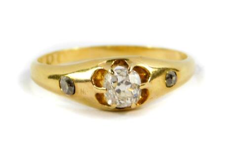 An 18ct gold and diamond three stone ring, set with rose cut diamonds, approx 0.4cts, size P, 2.5g.