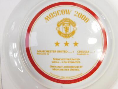 Manchester United. Four Danbury Mint collectors plates, with certificates, comprising The Old Trafford Centenary plate, One Hundred Years At The Top, Moscow 2008, and The Road To The Final. - 2