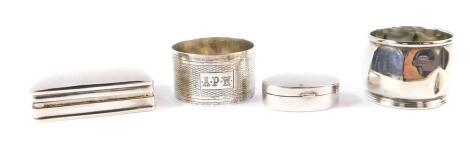 A George V silver octagonal salt cellar, liner lacking, Birmingham 1925, napkin ring, silver pill box stamped 925, and another London 1994, 2.99oz.