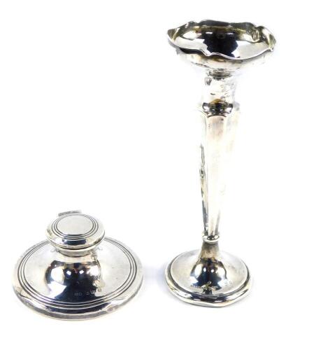 A George V silver loaded capstan inkwell, Birmingham 1911, together with a loaded silver bud vase, Birmingham 1912, 17.5cm high, 9.25oz all in.