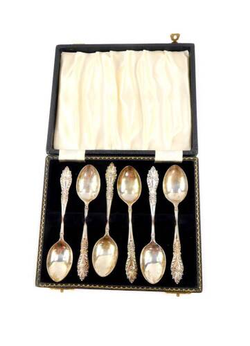 A set of six silver coffee spoons, with fancy terminals, cased, Adie Bros, Birmingham 1962, 2.70oz.