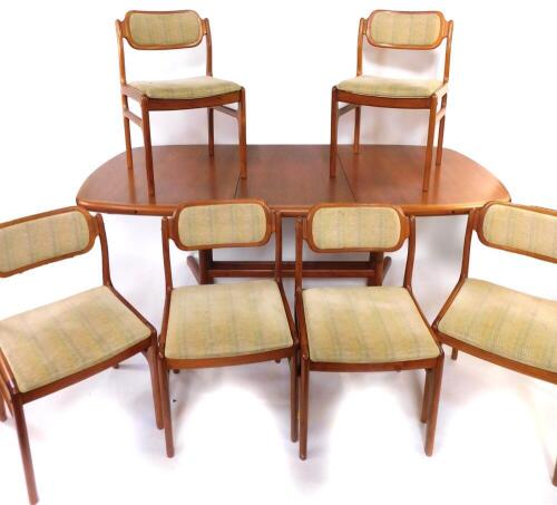 A d-SCAN teak dining room suite, comprising extending dining table and six chairs, table 97cm wide, 196cm long when extended. The upholstery in this lot does not comply with the 1988 (Fire & Fire Furnishing) Regulations, unless sold to a known exporter or