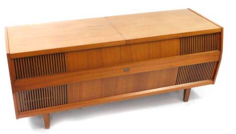 A HMV Solid State stereogram, in a vintage teak cabinet, 143cm wide.