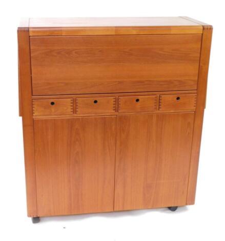 A d-SCAN teak side cabinet, with fall flap top, over four drawers and two door cupboard base, 116cm high, 103cm wide, 43cm deep, with one broken castor.