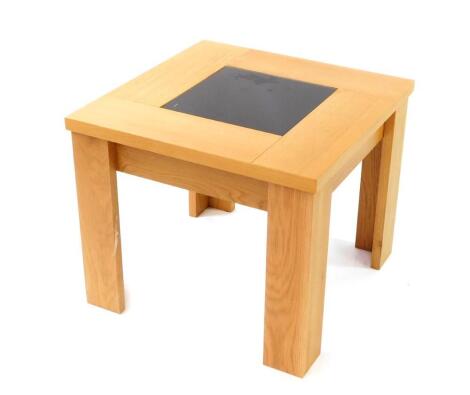 A modern oak coffee table, with glass centre, 60cm square.