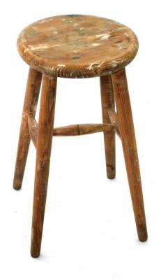 A late 19thC stripped pine stool, with circular seat, 47cm high.