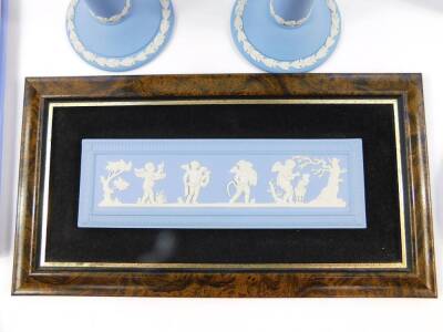 A group of Wedgwood light blue Jasperware, mostly boxed, including a pair of Dancing Hours candlesticks, a plaque, plates, and a book on Wedgwood by Geoffrey Wills. (a quantity) - 2