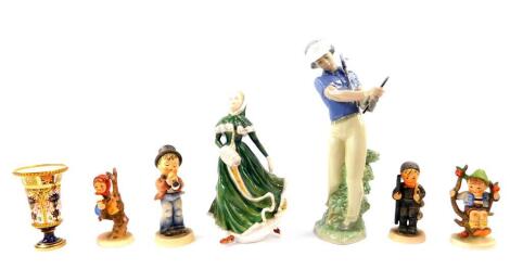 A Royal Crown Derby Old Imari porcelain spill vase, 10.5cm high., together with a Nao porcelain figure modelled as a Golfer., Petite Ladies Renaissance figure modelled as Katrina, and four Hummel figures including Apple Tree Boy & Girl. (7)