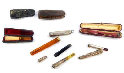 An amber cigarette holder, with an 18ct gold plated tip, a Rexala cigarette holder, cased, further cigarette holders and cigarette holder cases. (a quantity)