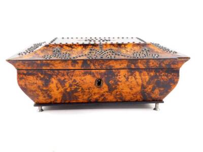 A Regency burr yew wood sarcophagus form casket converted to a musical box, the hinged lid with steel pin work decoration, mother of pearl reserve monogram engraved, 8cm high, 19cm wide, 13.5cm deep.