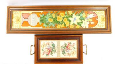 A set of five pottery tiles, tube line decorated with flowers in a vase, within a niche, framed, 75.5cm high, 14.5cm wide, together with a twin handled tray, inset with tiles printed with flowers, 43cm wide, 23cm deep. (2)