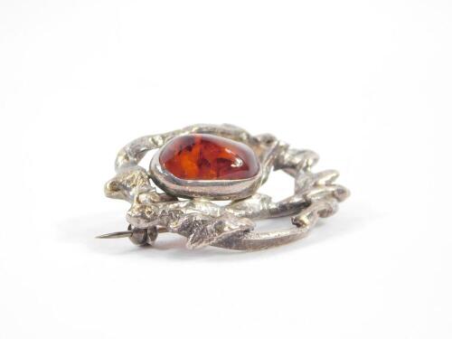 A silver and amber brooch, London 1980, 12.5g.