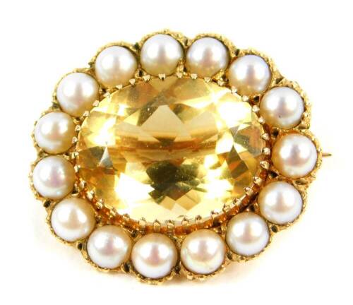 A 9ct gold and oval cut citrine brooch, in a surround of pearls, citrine approx 10.5cts, 8.3g.