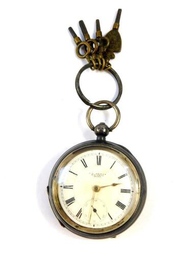 A Victorian gentleman's silver cased pocket watch, open faced, key wind, circular enamel dial bearing Roman numerals, subsidiary seconds dial, American Watch Company Movement, Waltham, Mass., No 8451299, the case with engine turned decoration, shield and