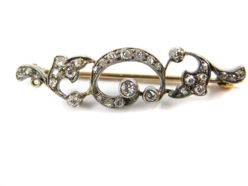 A Victorian diamond foliate scroll brooch, set in white and yellow metal, 3.3g.