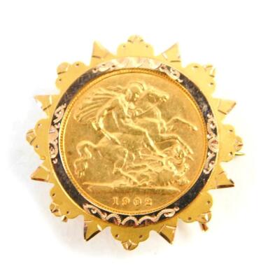 An Edward VII gold half sovereign 1902, in a 9ct gold brooch mount, 6.2g.