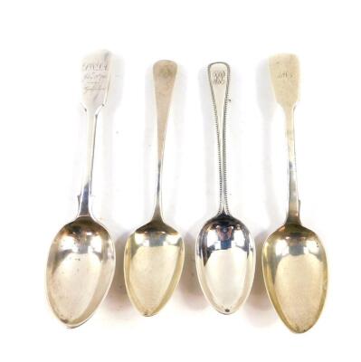 A William IV silver dessert spoon, initial engraved, London 1840., George IV dessert spoon, London 1822., Victorian beaded dessert spoon, monogram engraved, London 1871., and an Edward VII dessert spoon, later monogram and presentation engraved, London 19