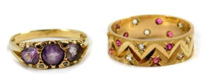 A 9ct gold and amethyst three stone ring, size N, and a 9ct gold and gem set band, size O, 5.0g.