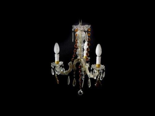 A cut glass three branch chandelier, with clear and amber glass drops, 48cm high, 34cm diameter.