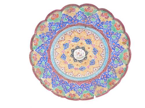 A Persian fluted 19thC enamel dish, painted centrally with birds within repeating floral borders, 22cm diameter.