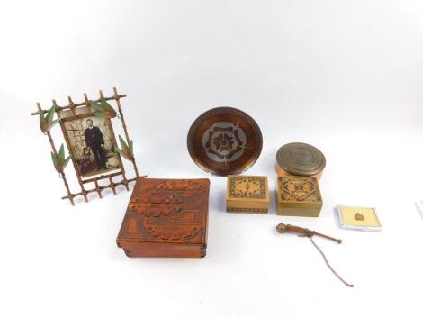 An H Heuguenin Swiss copper box, the lid embossed with 'Geneve, Oaux Saldats de 1914-1918', 12cm diameter, a Cornish copper and pewter dish decorated with a rose, two Tonbridge ware boxes, a Suffolk Regiment commemorative compact, Victorian style strut ph