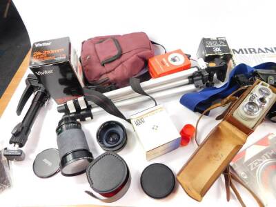 A Eumig Cine camera, model C3., Kodak camera, Zenit 11 camera, tripods, accessories and books. (a quantity) - 2