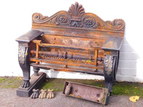 A late Regency cast iron and brass mounted fire grate and back, 88cm wide, 44cm deep, (AF).