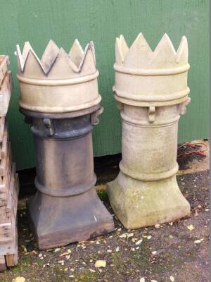 A pair of Victorian pale stone wear chimney pots, with crenellated tops, 91cm high, 35cm wide.