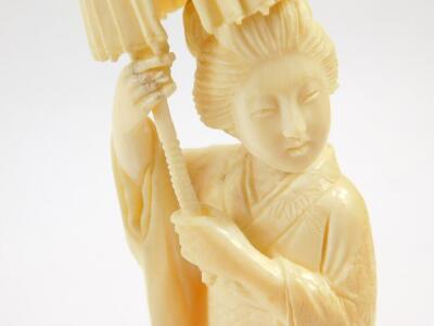 A Japanese ivory okimono figure of a geisha holding a parasol aloft, signed to base Taisho period, 21cm high. - 3