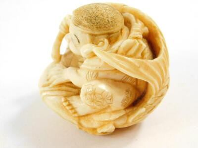 A Japanese ivory netsuke of Ebisu, seated on his giant carp, Meiji period, 6cm High. - 2