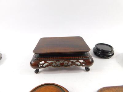 A group of Chinese hardwood ornament stands, (8). - 2