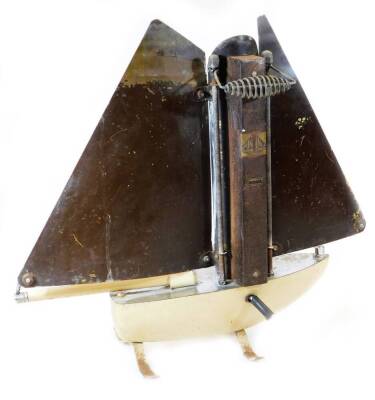 A mid 20thC Art Deco chrome plated Bunting ship heater, with two sails, central bulb and shaped stand, partially decorated in cream with electrical feature, 52cm high. (AF) - 3