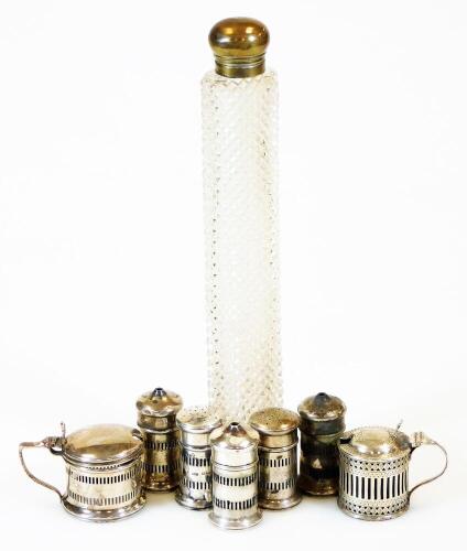 Various silver cruet items, pepper pots, salt pots, large perfume bottle with plated lid and glass stopper, Edwardian silver mustard pot with blue glass liner, partially engine turned, 5cm high, and six other items, some with liners, 8.5oz all in. (a quan