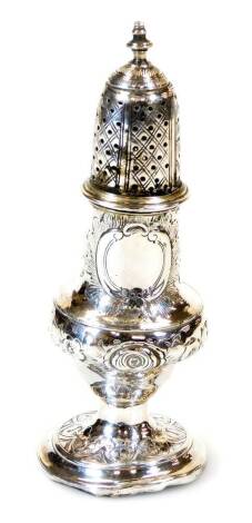 A George III silver caster, with pierced domed lid, urn finial, bellied circular body decorated with flowers on an inverted stem and circular foot, London 1792, 15cm high, 3oz. (AF)